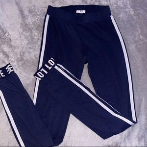 Ardene navy blue leggings with white strips and “love”writing on the ankles
